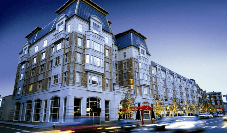 a gorgeous 5 story hotel on a busy street corner