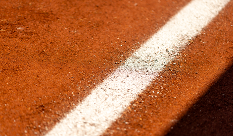 a close up of a chalk line on a baseball field